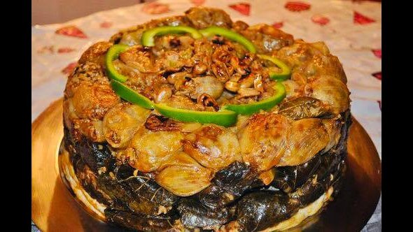 Charcoal-grilled kebabs on a serving plate.